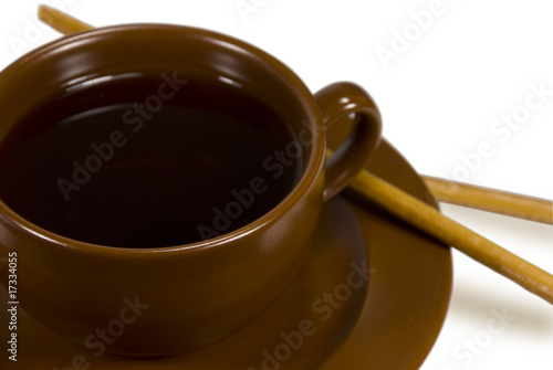 Cup of tea with grain sticks