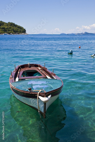 Blue and White Boat in Clear Blue Water
