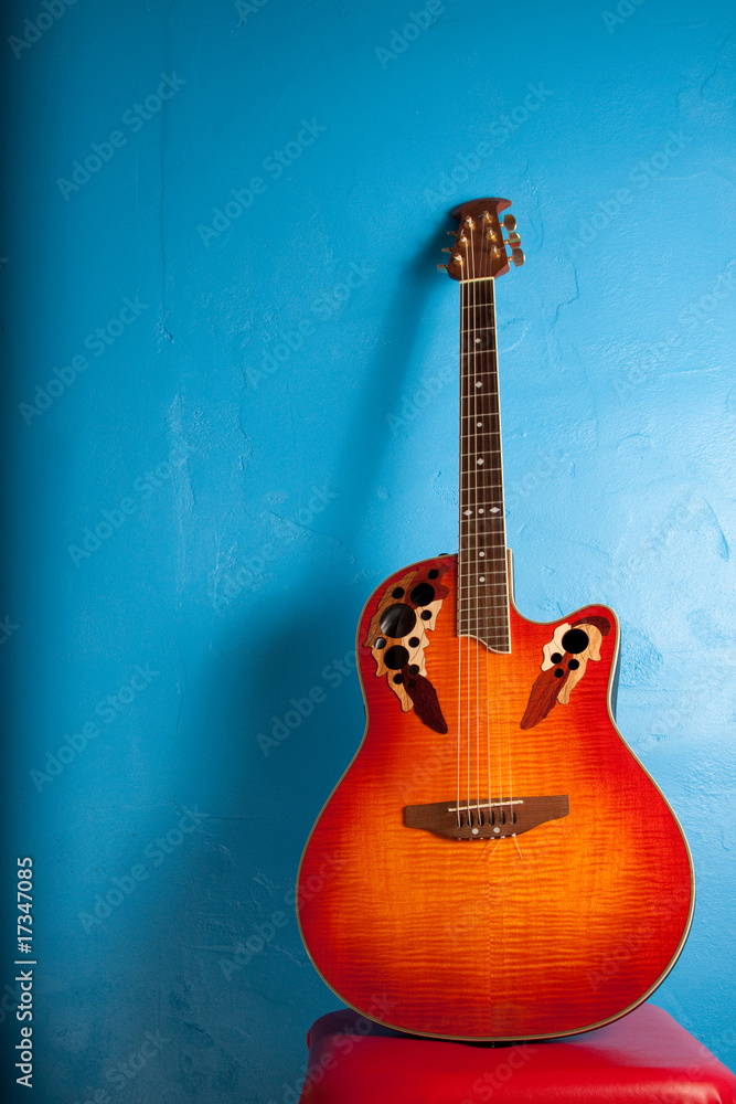 Semi-Acoustic guitar against blue