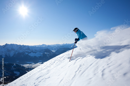 Wallpaper Mural woman skiing in powder snow Torontodigital.ca