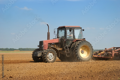 Agriculture ploughing tractor outdoors