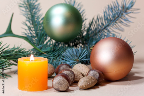 Christmas candles and baubles on background