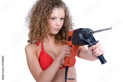 Beautiful girl holding perforator drilll with big auger