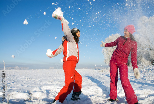 Two girls playing with snow