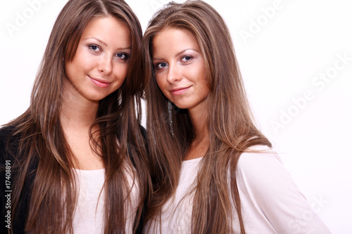 Two girls twins, isolated on the white