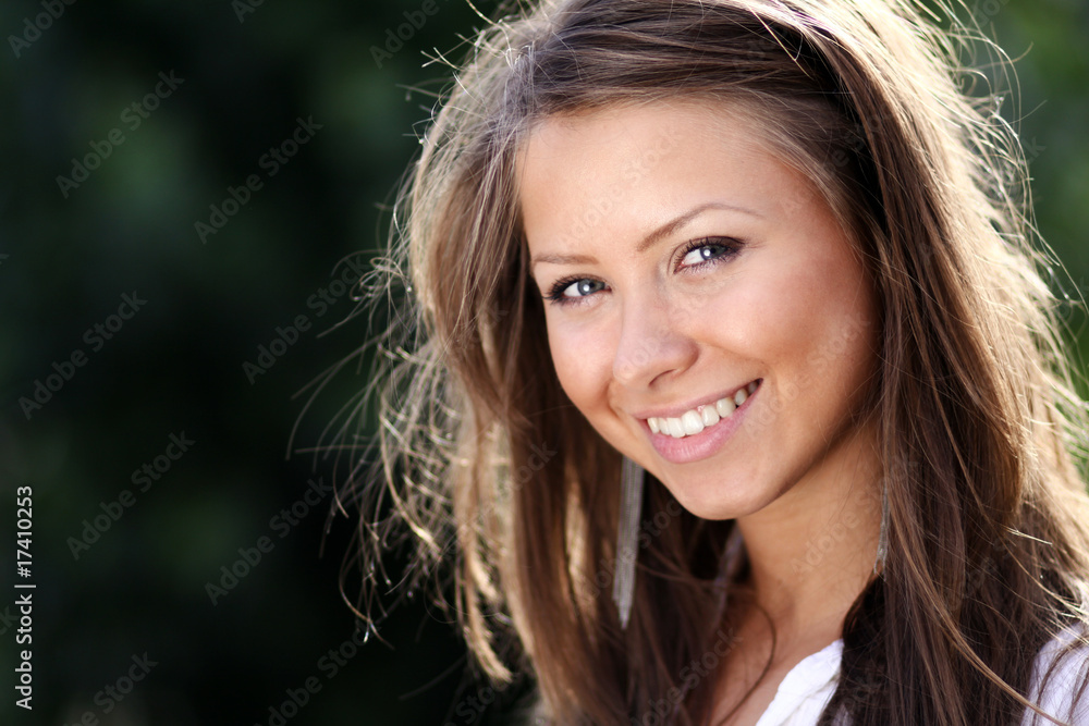 Closeup portrait of a happy young woman Closeup portrait of a happy young woman