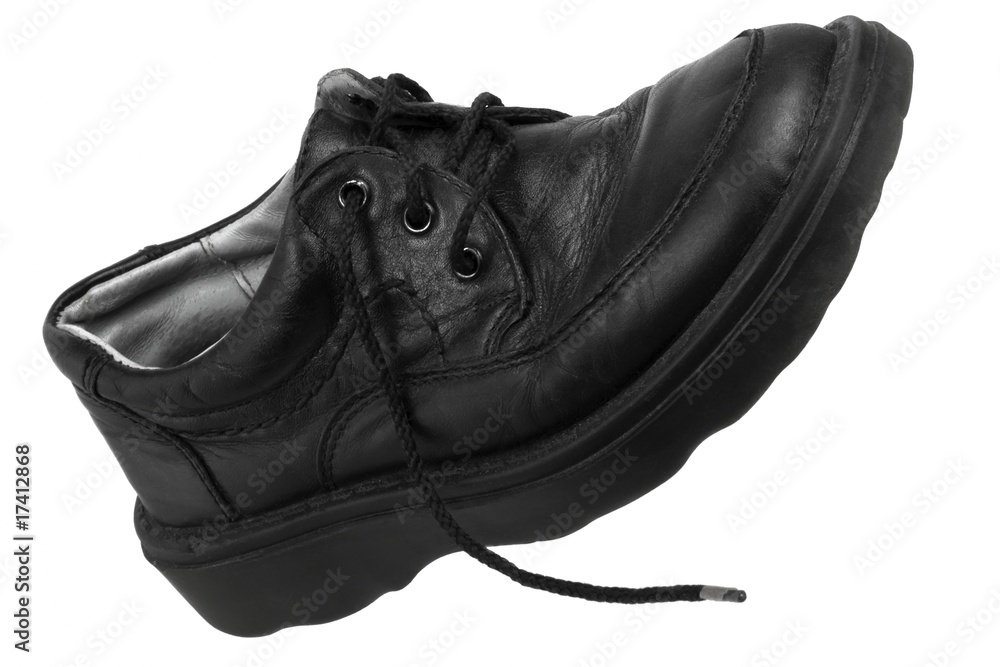 Leather boot with the untied lace, isolated on white background Leather boot with the untied lace, isolated on white background