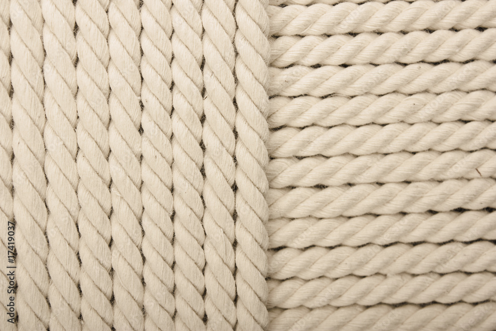 Heavy, white coiled rope. Heavy, white coiled rope.