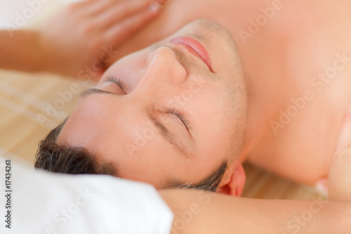 Relaxing man enjoying wellbeing wellness spa therapy