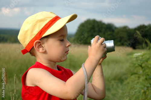 child taking a picture