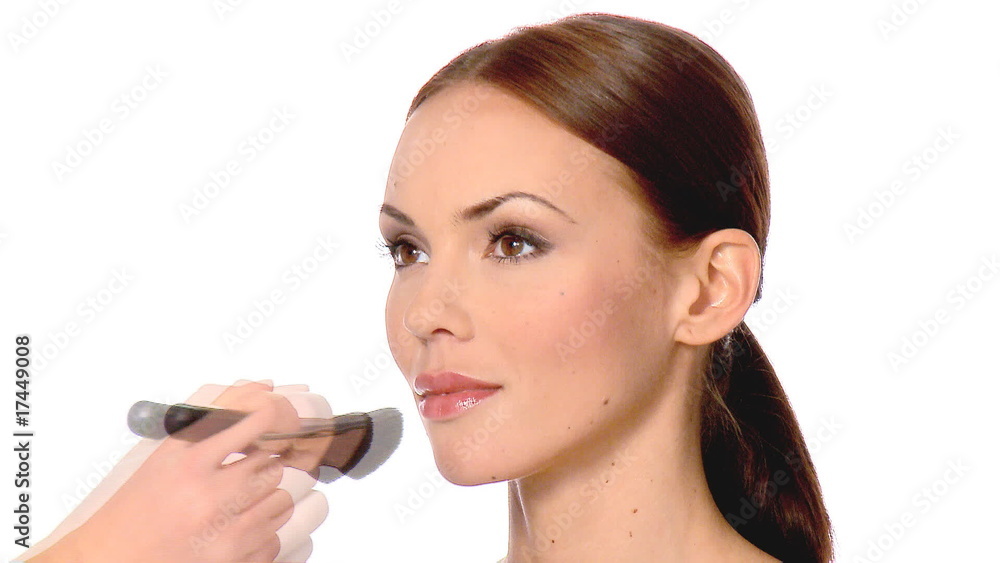 Makeup artist is doing makeup on beautiful woman Makeup artist is doing makeup on beautiful woman