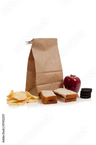 a Sack lunch with peanut butter sandwich photo