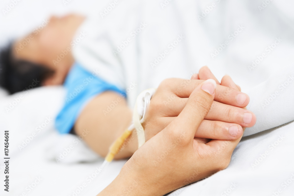 Holding patient hand in hospital Holding patient hand in hospital