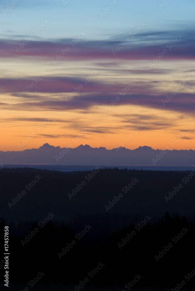 Vibrant blue orange sunrise over swedish mountains