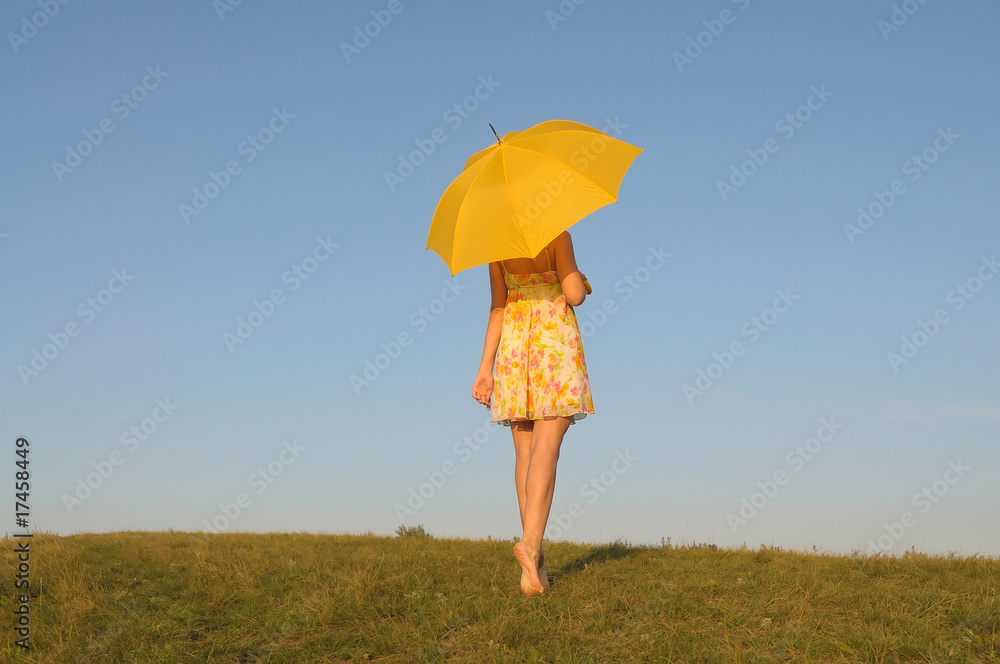 woman in a yellow dress with umbrella