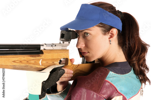 woman aiming a pneumatic air rifle photo