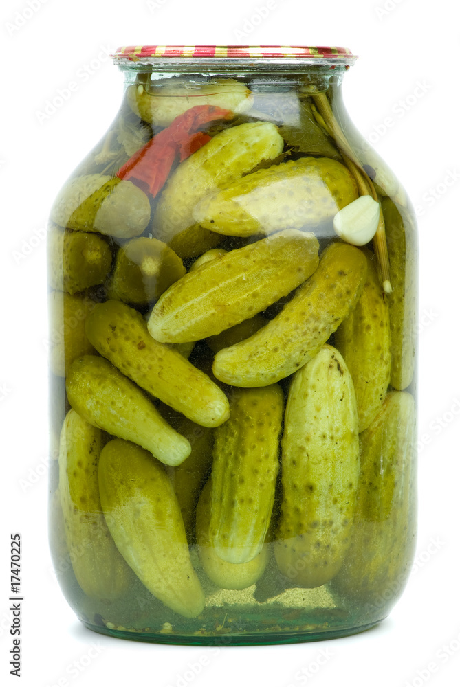 Big glass jar with home-made marinated cucumbers Big glass jar with home-made marinated cucumbers