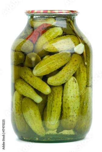 Big glass jar with home-made marinated cucumbers
