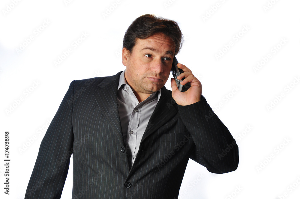 Studio Shot of Business Man making an very important phone call Studio Shot of Business Man making an very important phone call