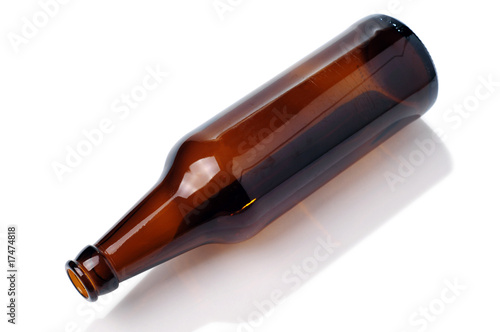 Empty brown beer bottle isolated on the white background