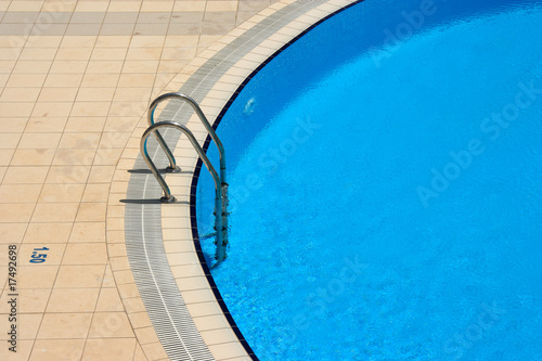 An image of blue swimming pool in summer © jokerpro
