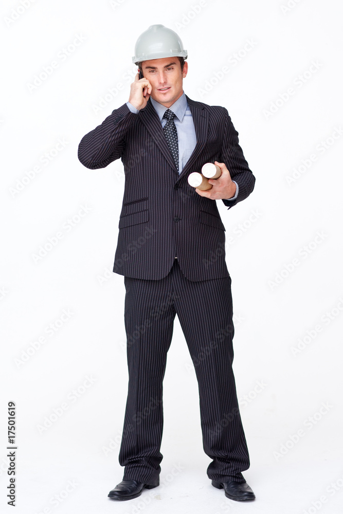 Attractive architect on phone holding plans Attractive architect on phone holding plans