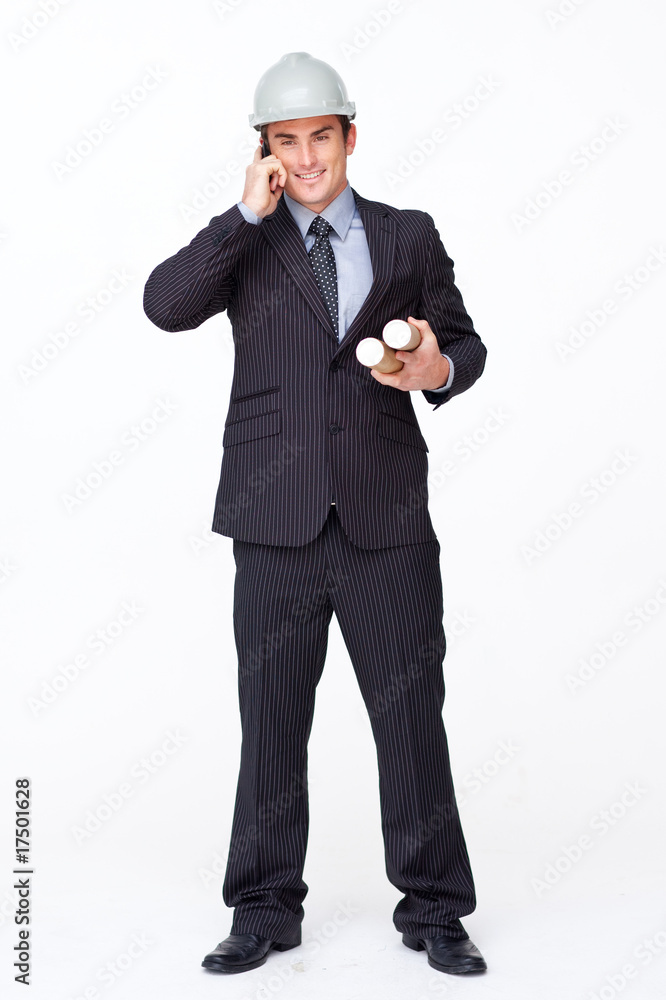 Smiling attractive architect on phone holding plans Smiling attractive architect on phone holding plans