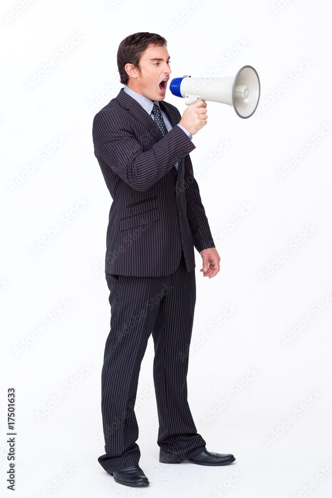 Standing businessman shouting through a megaphone Standing businessman shouting through a megaphone