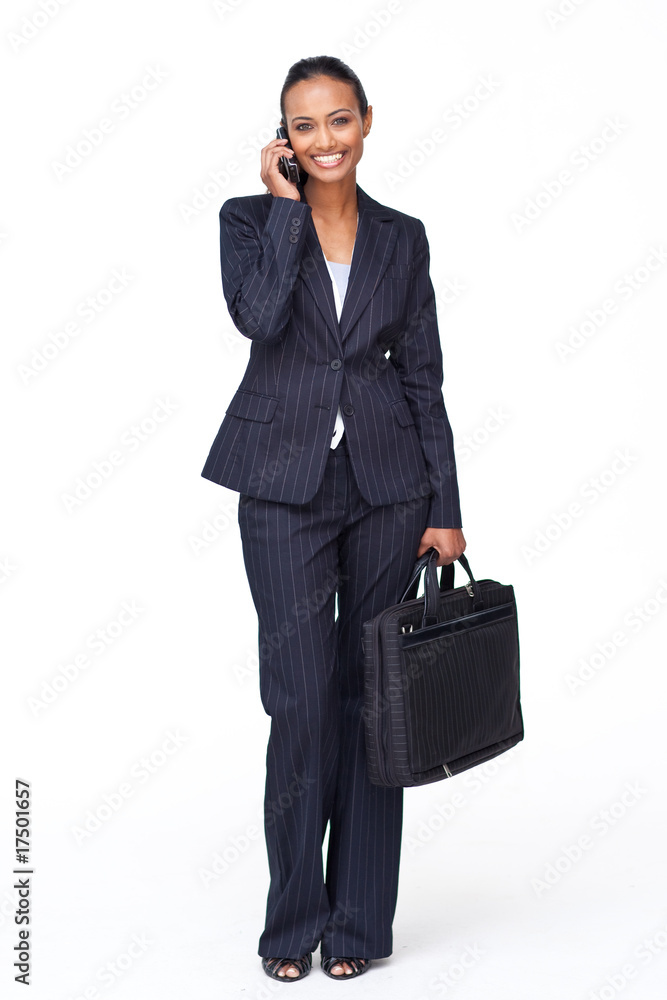Smiling Indian businesswoman on phone going to work Smiling Indian businesswoman on phone going to work