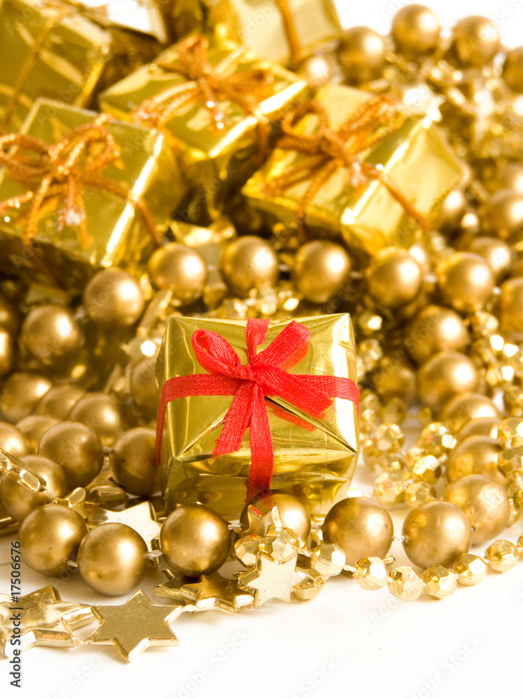Small golden gift with red ribbon. Shallow DOF. Small golden gift with red ribbon. Shallow DOF.