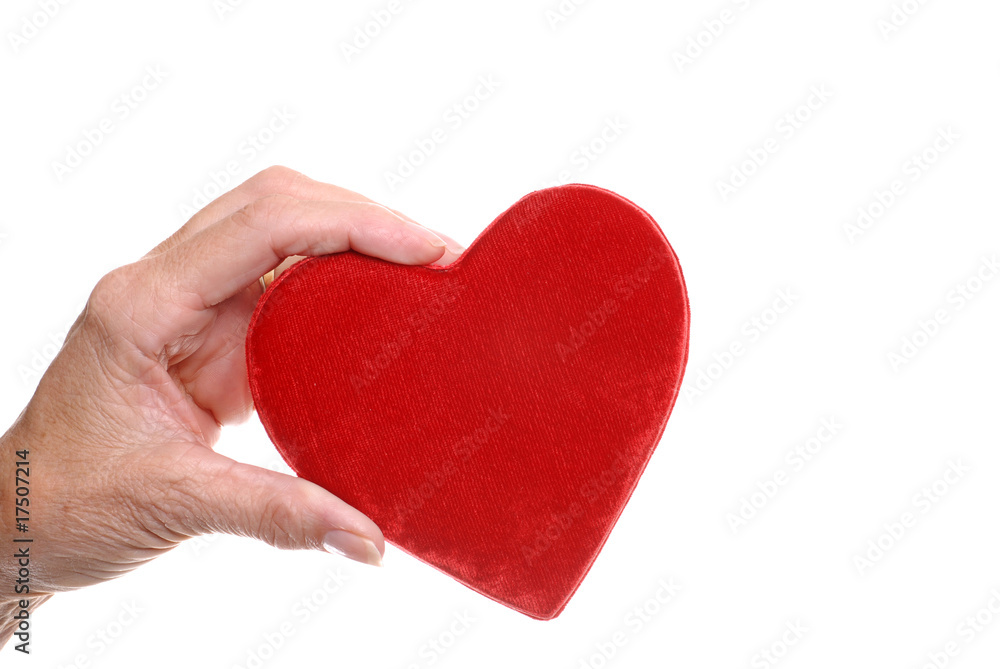 Obraz premium elderly woman hand holding red heart
