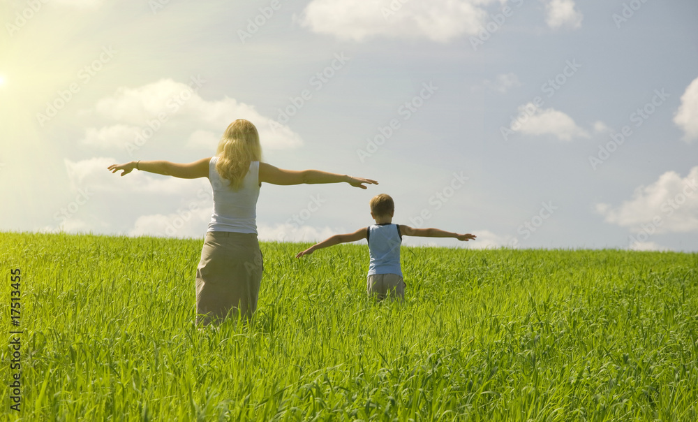ma and son walk in field. agricultural nature landscape with blu ma and son walk in field. agricultural nature landscape with blu