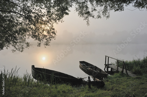 Boats at a sunrise photo