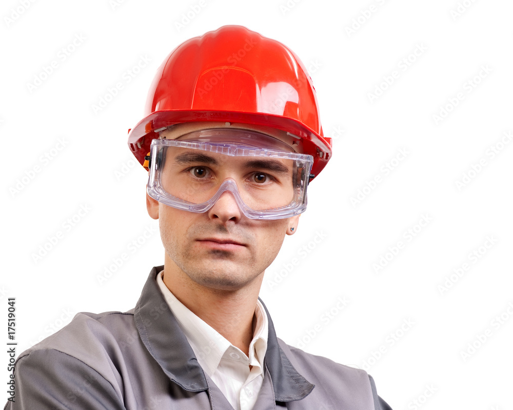 Serious architect, engineer, or supervisor in red hardhat Serious architect, engineer, or supervisor in red hardhat