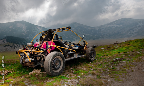 4wd buggy for extreme off-road shot on mountain photo