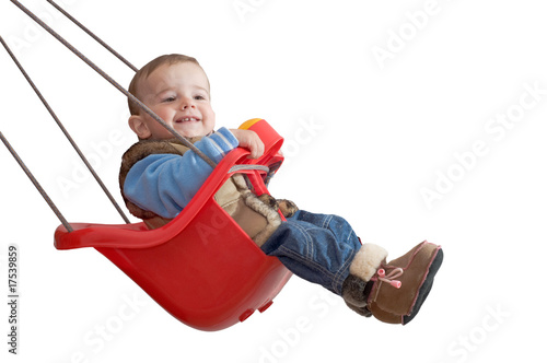 playful baby in a swing