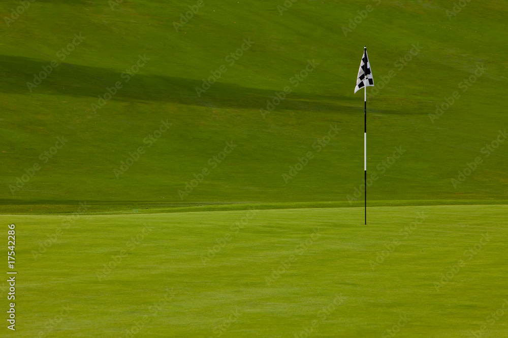 Golf course green with flag Golf course green with flag