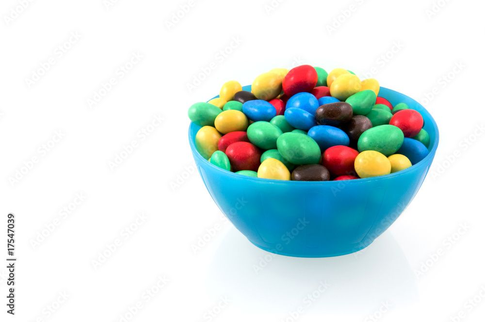 Colorful chocolate balls in blue bowl Colorful chocolate balls in blue bowl