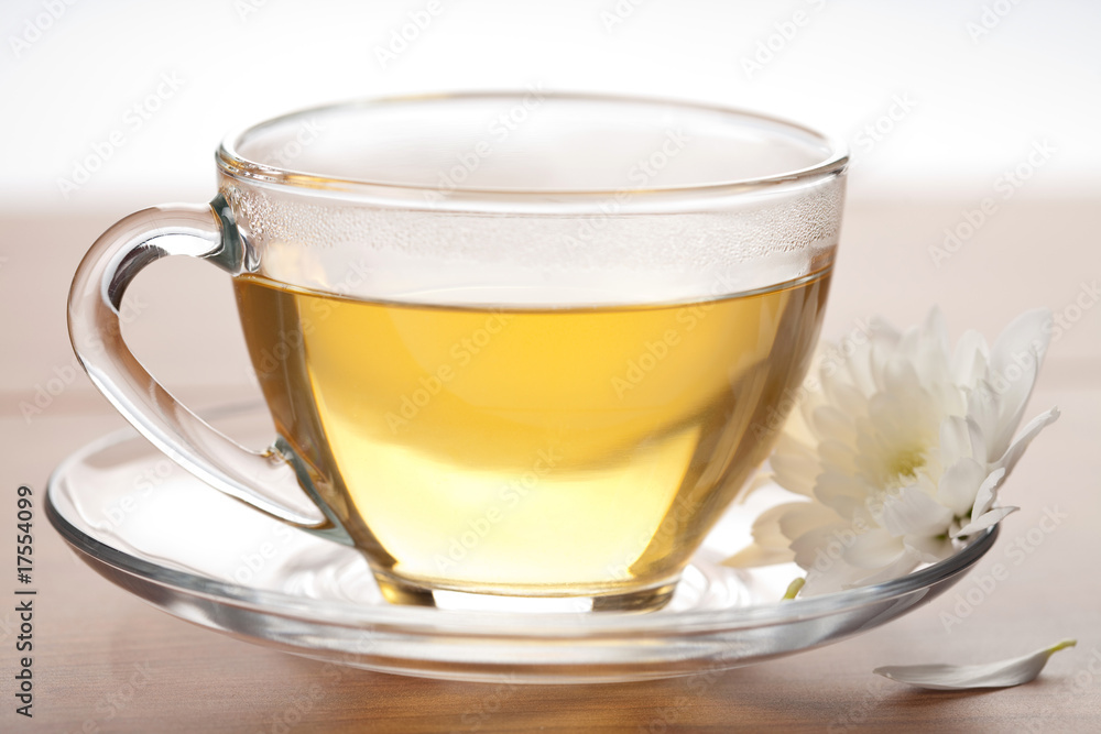 cup of green tea and white flower cup of green tea and white flower
