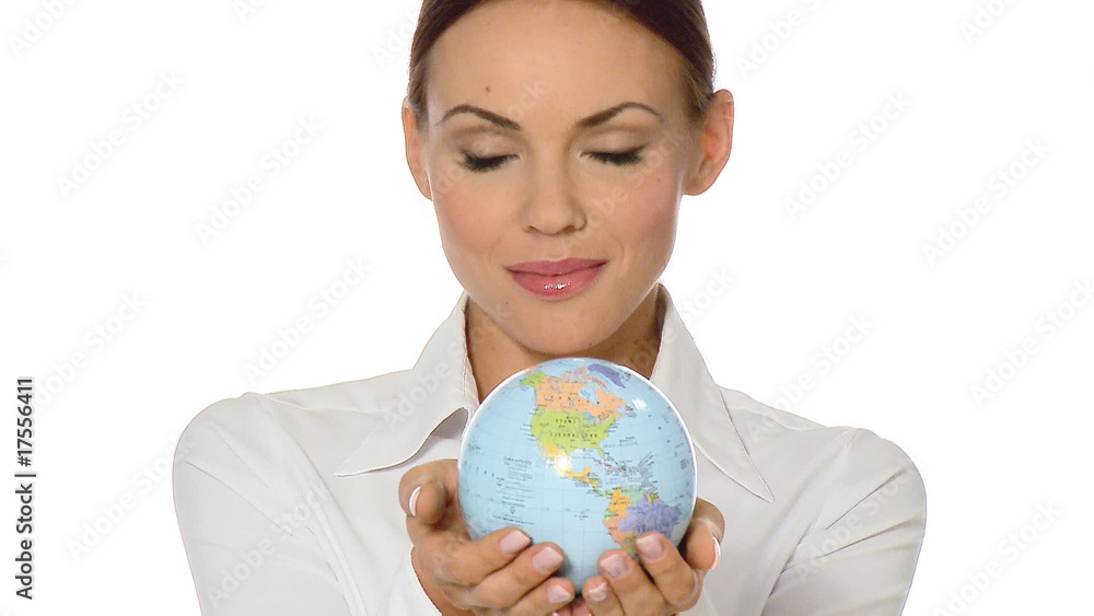Beautiful young businesswoman is holding a globe Beautiful young businesswoman is holding a globe