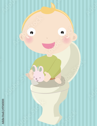 Baby boy sitting on the toilet