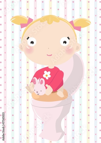Baby girl sitting on the toilet