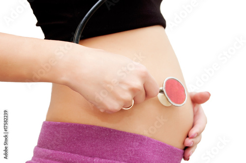 Pregnant woman's belly with stethoscope