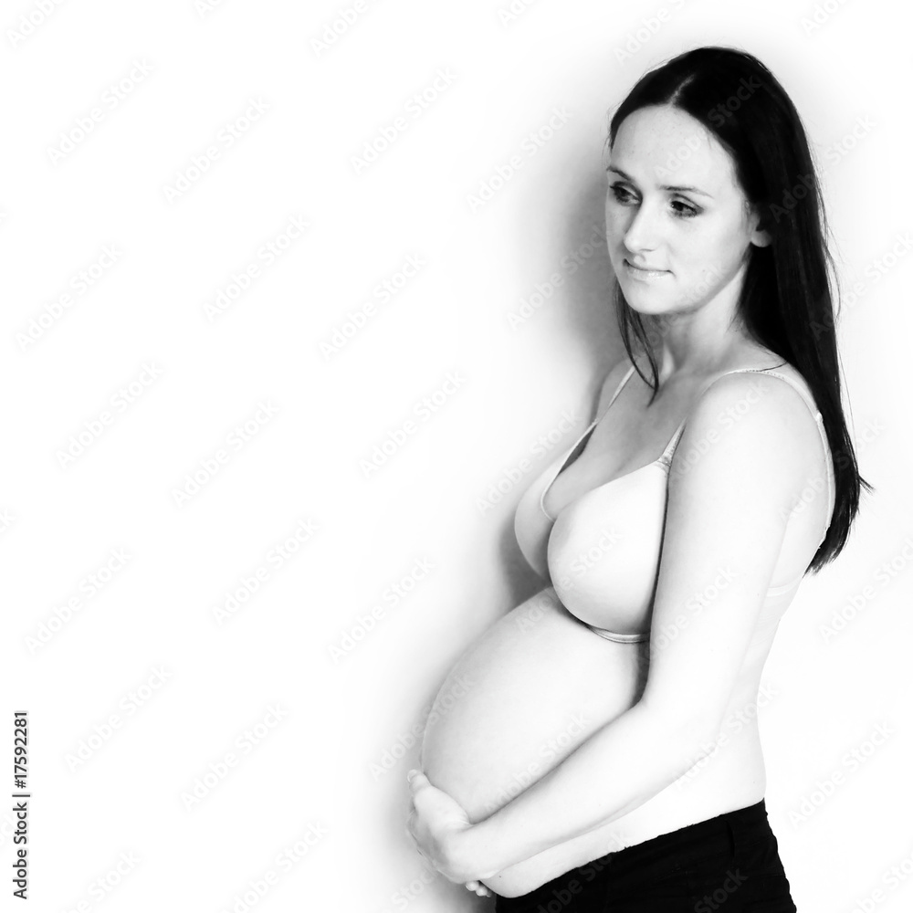 Pregnant woman holding her belly Pregnant woman holding her belly