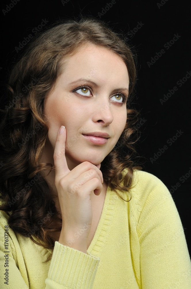 Portrait of young dreamy woman on black Portrait of young dreamy woman on black