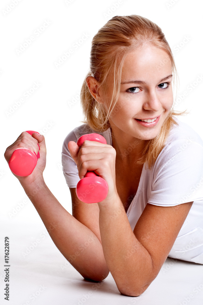 pink dumbbells in the hands of women pink dumbbells in the hands of women