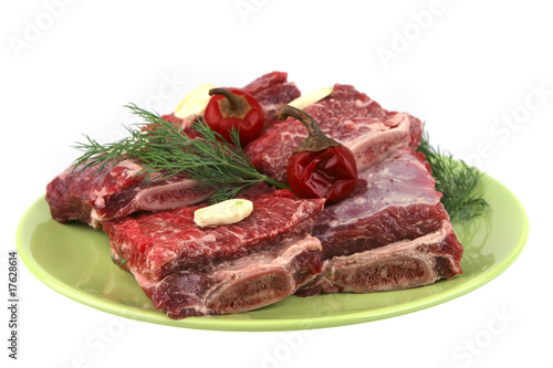 uncooked ribs on green dish