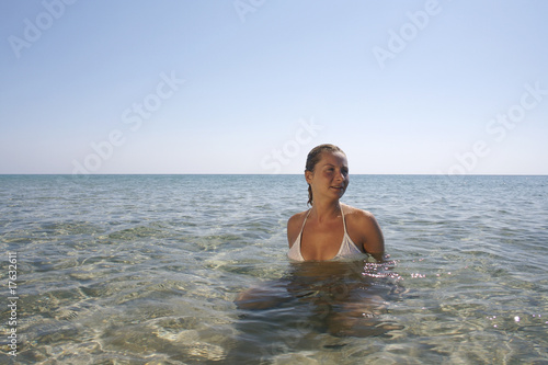 Young woman in the calm sea.