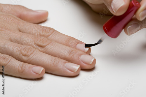 Young woman painting nails