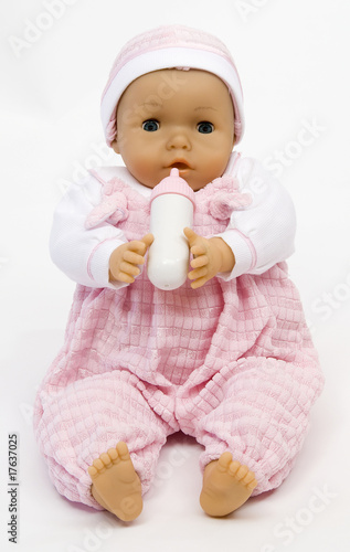 Baby doll with a feeding bottle